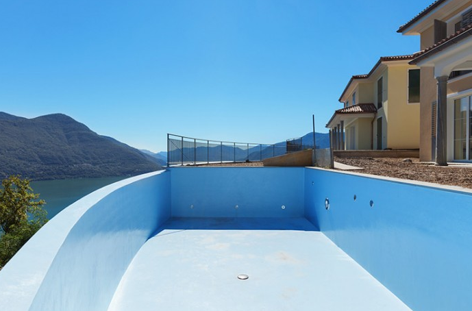 Waterproofing swimming pools with polyurea elastomer
